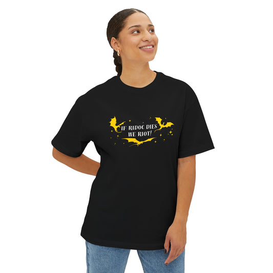 Person wearing a black t-shirt with yellow text on a white background