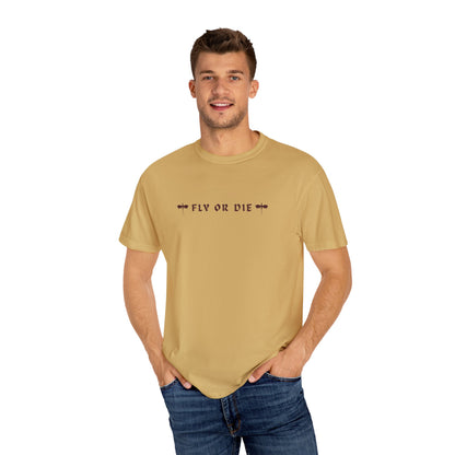 Man wearing a beige t-shirt with 'FLY OR DIE' text on a white background