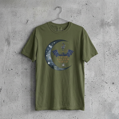 Green t-shirt with graphic design on a hanger against a concrete wall