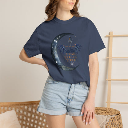 Person wearing a navy blue t-shirt with a graphic design and text, standing against a neutral background.