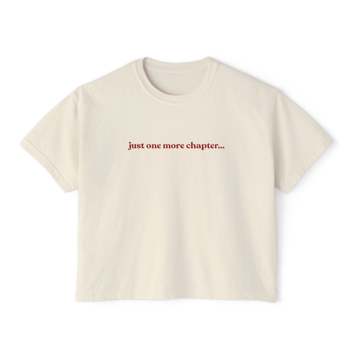 Beige t-shirt with 'just one more chapter...' text on a white background