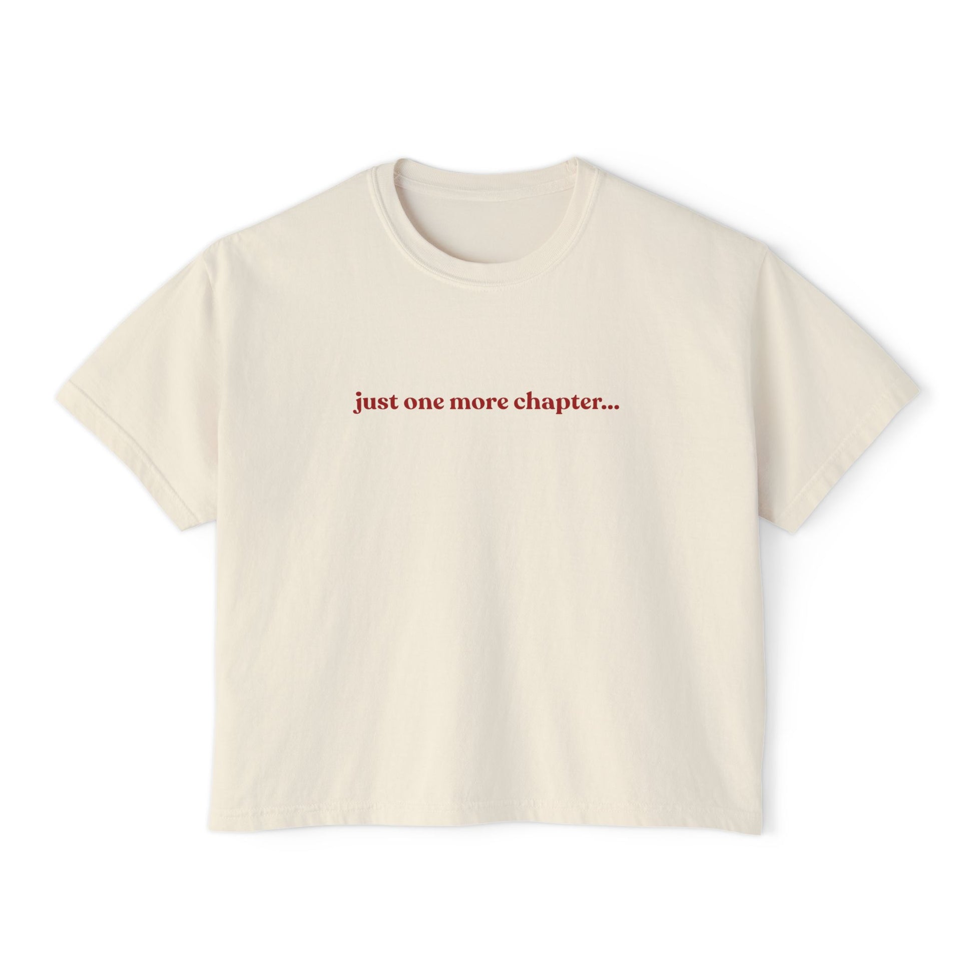 Beige t-shirt with 'just one more chapter...' text on a white background