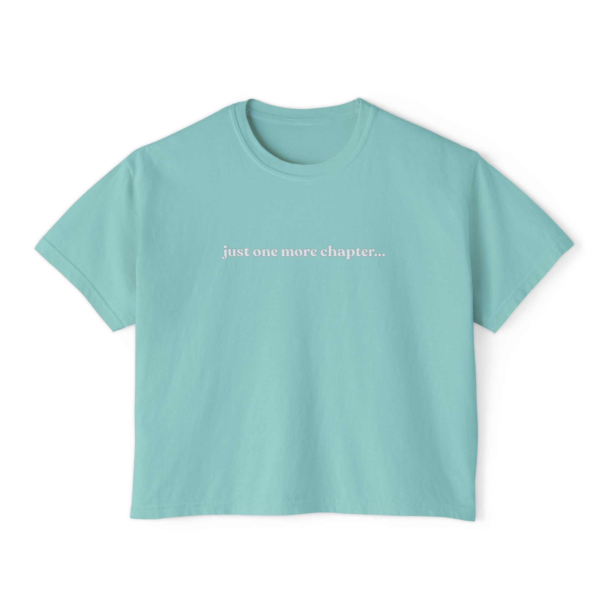Light blue t-shirt with 'just one more chapter...' text on a white background