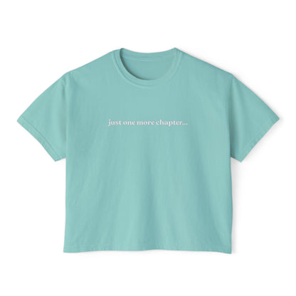 Light blue t-shirt with 'just one more chapter...' text on a white background