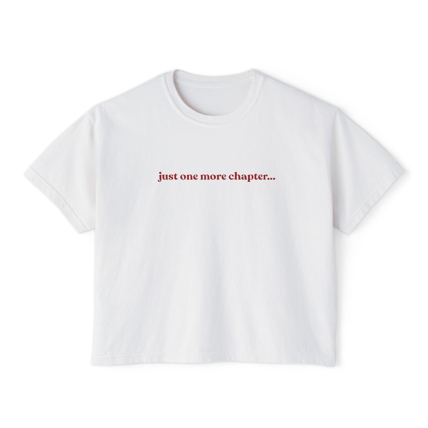 White t-shirt with red text 'just one more chapter...' on a white background