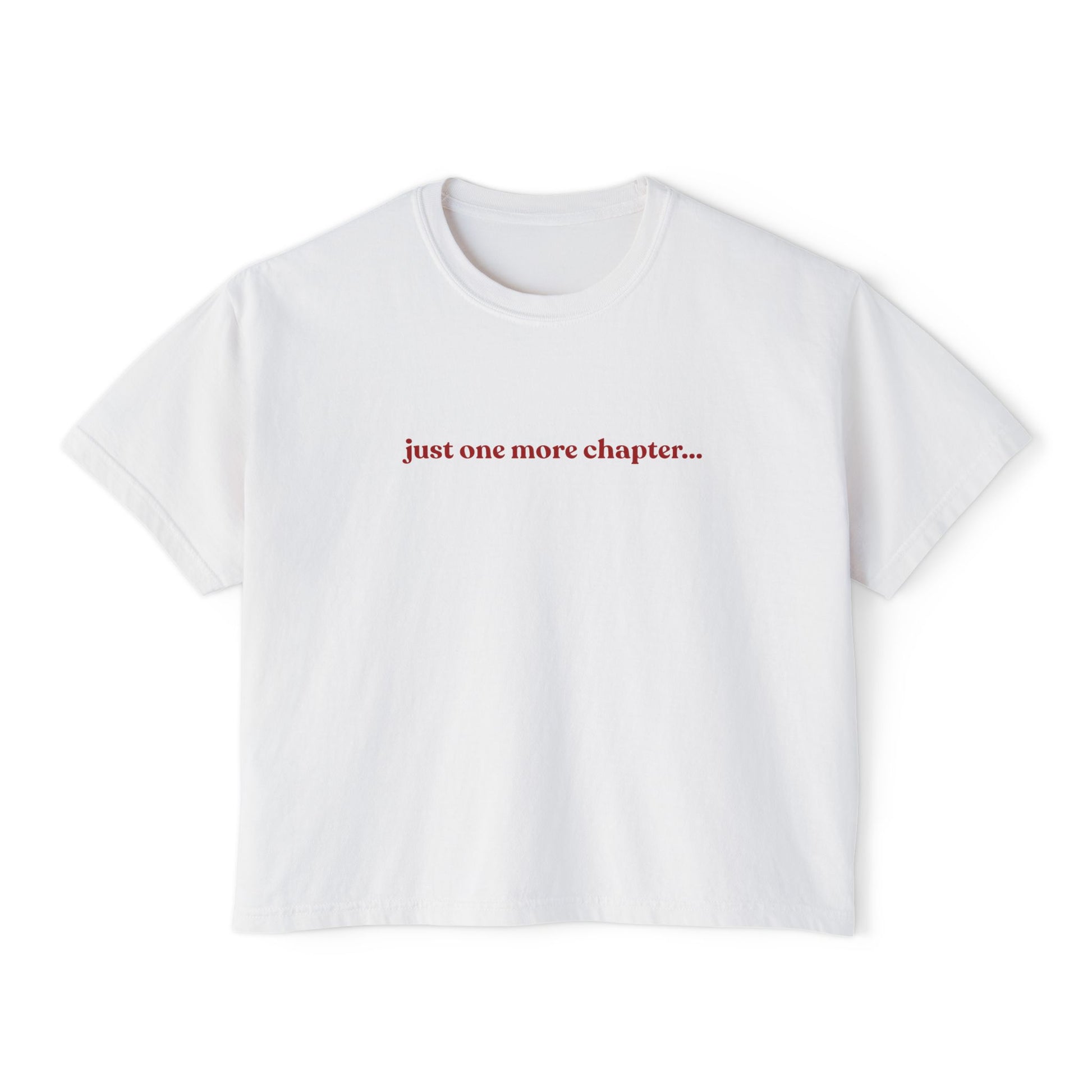 White t-shirt with red text 'just one more chapter...' on a white background